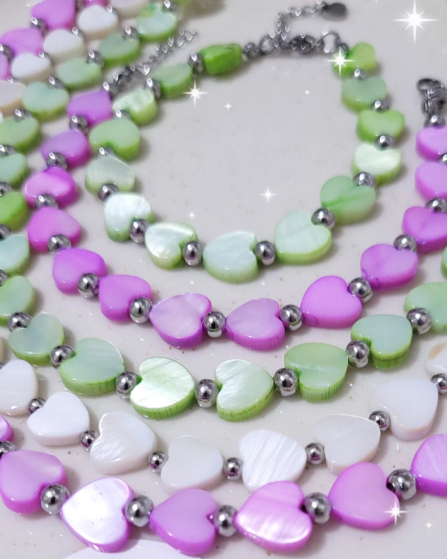 Collana & Bracciale Cuori in conchiglia tipo madreperla e acciaio mis. regolabile