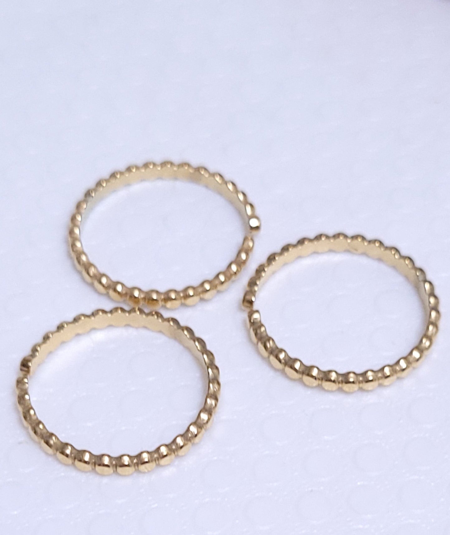 Anello a pallini tipo ferma-anello in acciaio dorè mis. regolabile