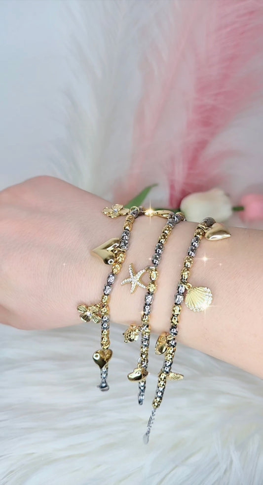 Nuovi bracciali tipo Dodo pepite in acciaio mix Silver & Gold con charms anche sonaglio e zirconi