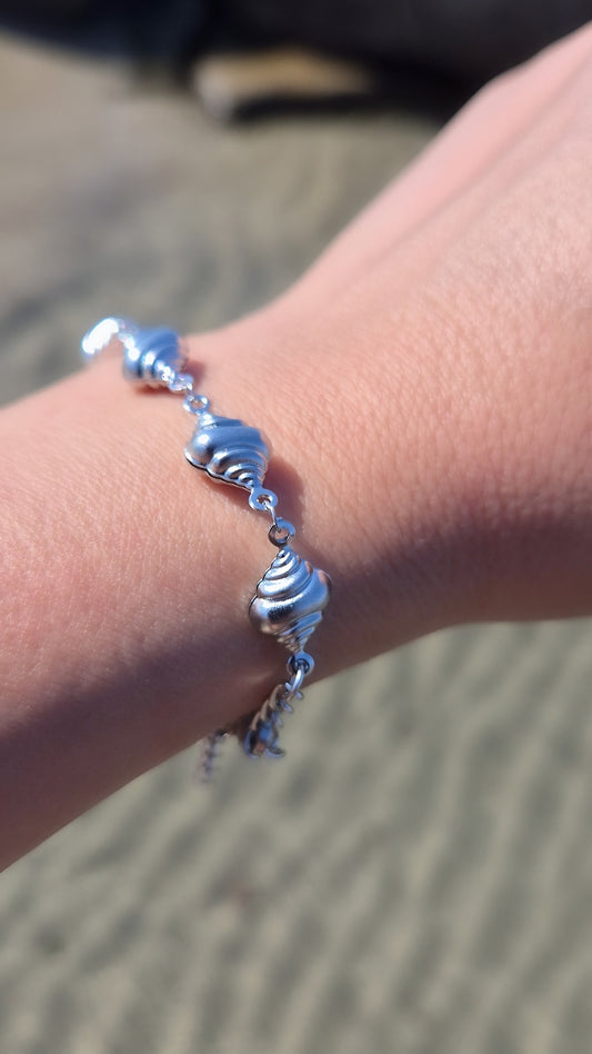 Bracciale conchiglia Paguro Estate 2026 *effetto sonaglio* in acciaio silver misura regolabile