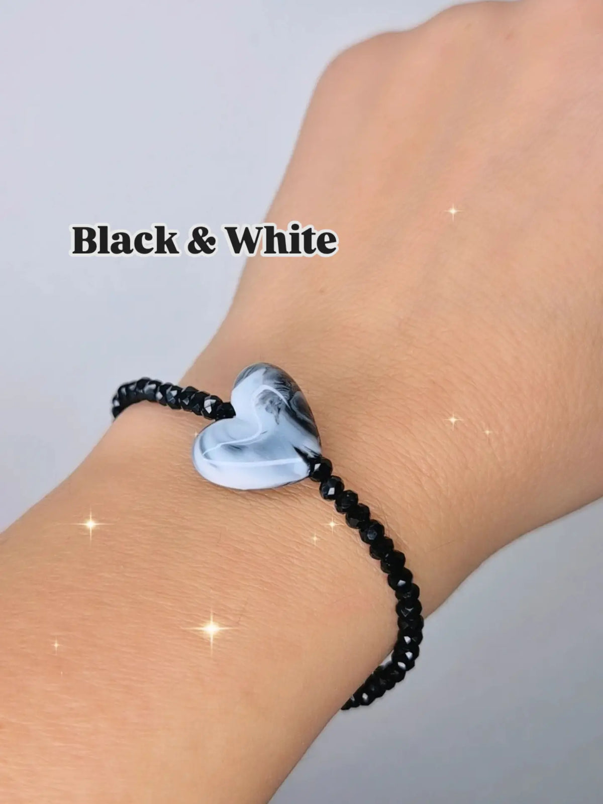 Bracciali elastici cristallini luminosi multisfaccettati neri con Cuore in resina effetto marmorizzato