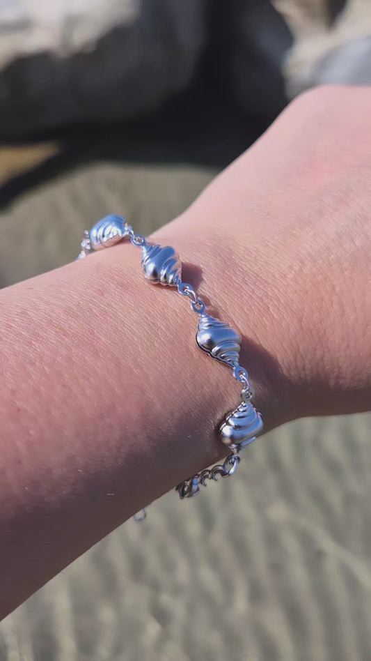 Bracciale conchiglia Paguro Estate 2026 *effetto sonaglio* in acciaio silver misura regolabile